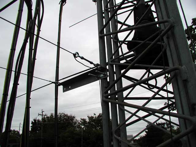 Ladder-line rope bracket on tower