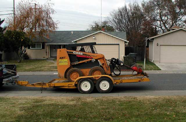 Bobcat on flatbed trailer