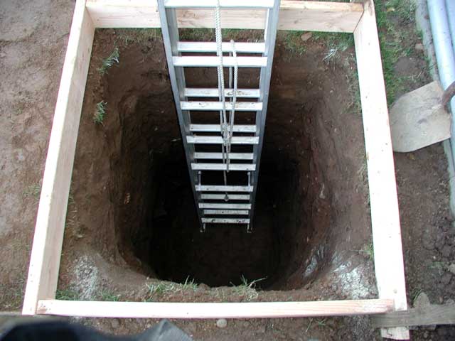 Ladder descending into hole