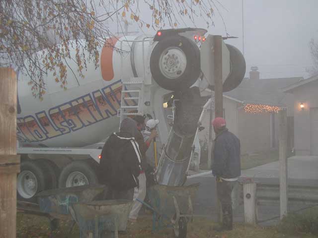 Cement truck filling wheel barrows