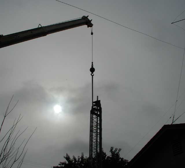 Tower hanging from crane